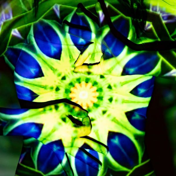 Woman doing a dynamic yoga stretch, radiating positive energy.